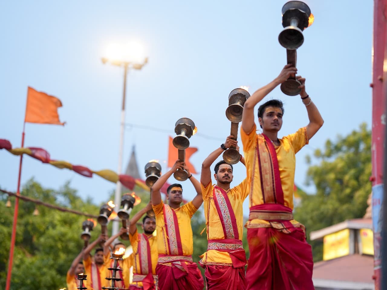 Ganga Aarti Ceremony with priests holding fire lamps
